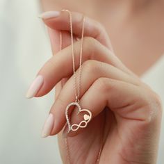 "Title: Heart Infinity Necklace, Minimal Heart Necklace, Valentines Necklace. * Material : Sterling Silver 925. * Finish: 925 Sterling Silver. * All jewelries that we sell are handmade. * This necklace is a great way to show your love and It will also look great with your outfits. * Our chain lengths are 16\", 17\", 18\" extender. * Our processing time is between 5 to 8 business days. It depends on pick seasons and busyness. IMPORTANT: **Please don't forget to customize this item with materials( Infinity Heart Pendant, Infinity Jewelry For Valentine's Day Gift For Mom, Infinity-shaped Jewelry For Mom For Valentine's Day, Infinity Necklace For Mom On Valentine's Day, Valentine's Day Infinity Jewelry Gift For Mom, Rose Gold Sterling Silver Jewelry With Heart Beads, Heart Charm Infinity Necklace For Valentine's Day, Infinity Heart Charm Necklace For Valentine's Day, Sterling Silver Infinity Heart Necklace For Anniversary