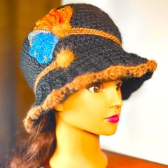 Wrap Yourself In Cozy Warmth With Our Autumn Elegance Knitted Button Hat. This Stylish Accessory, Adorned With A Subtle Blend Of Brown And Black, Is The Perfect Complement To Your Fall Wardrobe. The Knitted Texture Adds A Touch Of Comfort, While The Button Detail Enhances The Hat's Charm. Designed To Keep You Both Chic And Warm, This Hat Is A Versatile Choice For Autumn Strolls Or Casual Outings. Embrace The Season With Style And Comfort In This Fashionable Addition To Your Cool-Weather Wardrobe Crochet Hats For Older Women, Black One-size Crochet Hat, Black Wide Brim Crochet Hat For Winter, Adjustable Black Crochet Hat For Fall, Black Wide Brim Crochet Hat, Black Fitted Crochet Hat, Black Hand Knitted Hat One Size, Black Hand-knitted Hat One Size, Black Hand Knitted Hat