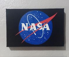 the nasa logo is painted on a white wall