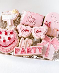 decorated cookies in a box for a birthday party