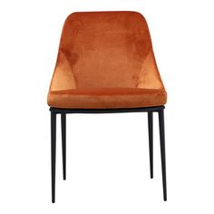 an orange velvet chair with black legs