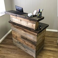 an office desk made out of pallet wood