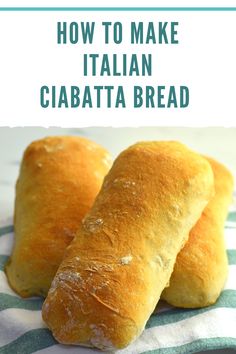 two italian ciabatta breads sitting on top of a green and white towel