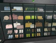 a display case filled with lots of different types of purses