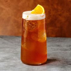 a drink with an orange slice in it