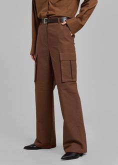 Color: BrownLightweight cotton fabricRelaxed cargo styleEnlarged cargo pockets at each legSlant hip pocketsAdjustable toggles at hemHook and bar closureZip flyUnlined100% CottonDry CleanBy The Frankie Shop. Imported Brown Cargo Pants With Multiple Pockets, Brown Utility Parachute Pants Full Length, Brown Utility Parachute Pants, Brown Cargo-style Parachute Pants, Brown Cargo Style Parachute Pants, Brown Full-length Cargo Pants With Pockets, Brown Full-length Utility Parachute Pants, Brown Utility Cargo Pants, Brown Straight Utility Cargo Pants