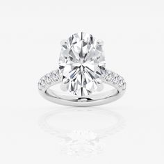 a diamond engagement ring on a white background