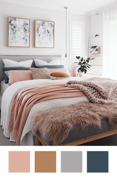 a bedroom with white walls, grey bedding and pink blankets on top of the bed