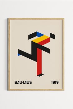 a framed poster with the word bauhus in red, yellow and blue on it