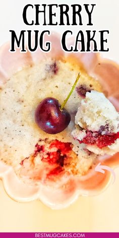 a close up of a piece of cake with cherries on it and the words cherry mug cake