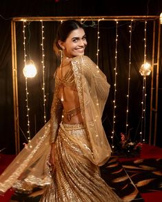 This dark gold lehenga is hand embroidered with all over sequin and cutdana work in a geometric pattern. Paired with a full sleeves v-neck blouse and embroidered dupatta in net.DELIVERY TIMEPlease allow 8-12 weeks for your outfit to arrive.FABRIC DETAILSNetProfessional cleaning only. Silver Bridal Lehenga, Lehenga Gold, Cutdana Work, Gold Lehenga, Reception Outfit, Crystals Beads, Traditional Indian Outfits, Embroidered Dupatta, Dark Gold