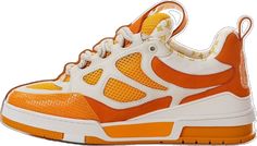 an orange and white sneaker is shown with the upper part of it's shoe