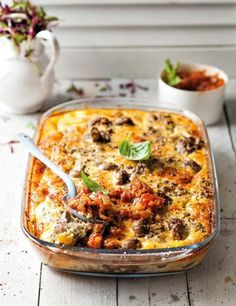 a casserole dish with meat and vegetables in it