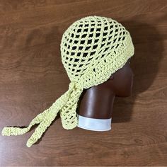 a crocheted hat on top of a mannequin head