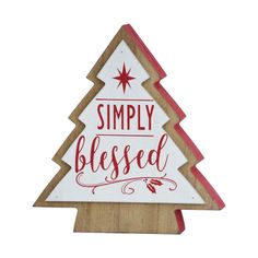 a wooden christmas tree sign with the words simply blessed on it's bottom half