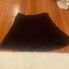 Black Flowy Skirt. Super Cute. Never Warn. Only Tried On. Has A Black Zipper In The Back Of The Skirt. Casual Black Skirt For Going Out, Black Stretch Mini Skirt For Day Out, Black Flowy Mini Skirt For Day Out, Black Lined Mini Skirt For Going Out, Black Flared Mini Skirt For Day Out, Black Flowy Skort For Party, Black Stretch Skirt For Day Out, Black Flowy Skort With Lined Skirt, Black Skort With Flowy Skirt