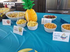 a table topped with lots of different types of snacks and desserts on top of it