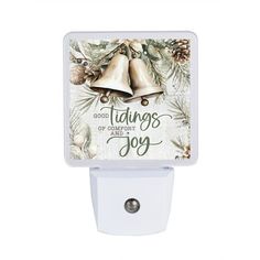 a white night light with an image of two bells on it and the words, good things