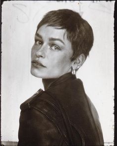 black and white photograph of a woman with short hair wearing a leather jacket looking to the side