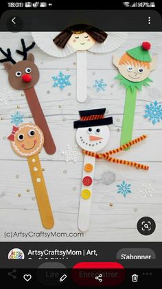 paper stick snowman craft for kids to make with christmas themed items on the table