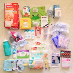 the contents of a baby's diaper laid out on a bed