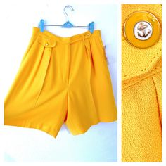 "♥ Dressy, tailored shorts by LIZ CLAIBORNE COLLECTION. ♥ New With Tags, suggested retail $82 :) ♥ Vibrant yellow. ♥ Has a silky, light, smooth interior lining. ♥ Crisp pleats. ♥ Zipper fly and cute nautical anchor buttons. ♥ Fast FREE Shipping! ♥ Ask for a discount on bundles.  ♥ INSTAGRAM: franzialux_rellickroad MEASUREMENTS (FLAT)  * INSEAM: 8\"  * WAIST: 16\" (across)  * TOTAL LENGTH: 21\"   *FIT / SIZE: Labeled Size 14, best fit on Size L to XL. *MATERIAL: Triacetate, Polyester *CONDITION: Excellent / New With Tags *BRAND: Liz Claiborne Collection PLEASE NOTE: All items are gently used to pristine. I hand-wash or gently cycle garments with organic, earth-friendly soaps. Sometimes fragile or complex items will be sent \"as found\" to maintain their integrity. On the rare occasion that Yellow Summer Shorts For Work, Yellow Workwear Bottoms Shorts, Yellow Short Bottoms For Work, Yellow Short Length Bottoms For Workwear, Yellow Short Length Workwear Bottoms, Vintage High Waist Shorts For Workwear, Vintage High-waist Shorts For Work, High Waist Vintage Shorts For Workwear, Vintage Workwear Shorts For Summer