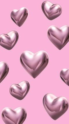 many shiny hearts on a pink background