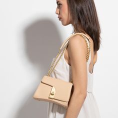 The Arcadia Arco is a mini crossbodies. With its unconventional design, it is a sculptural shape with a flexible geometry. Modern Clutch Shoulder Bag With Chain Strap, Modern Shoulder Bag With Chain Strap Clutch, Modern Box Bag With Chain Strap, Modern Beige Evening Bag With Gold-tone Hardware, Modern Office Flap Bag With Chain Strap, Modern Crossbody Box Bag With Chain Strap, Modern Chain Strap Flap Bag For Everyday, Modern Flap Bag With Chain Strap For Everyday Use, Modern Beige Evening Flap Bag