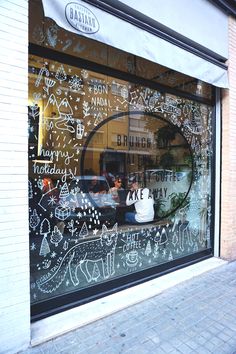 a store window with writing all over it