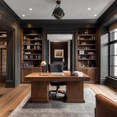 a home office with built - in bookcases and leather chairs, along with a large desk