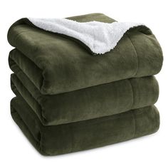 three blankets stacked on top of each other