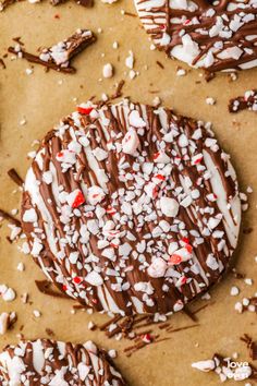 chocolate covered cookies with white and red sprinkles