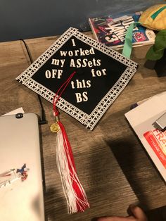 a graduation cap that says i worked my assofts off this bs