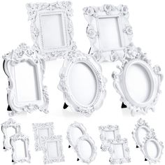 an assortment of white ornate frames on a white background