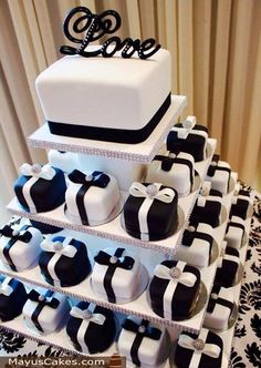 a wedding cake with black and white decorations