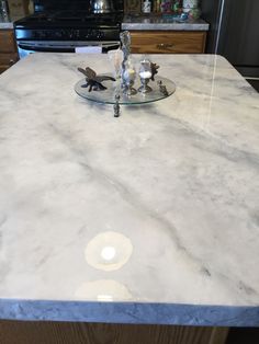 a white marble counter top in a kitchen