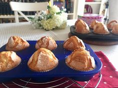 a blue tray filled with pastries on top of a table