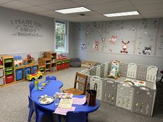 a child's playroom with toys and storage bins