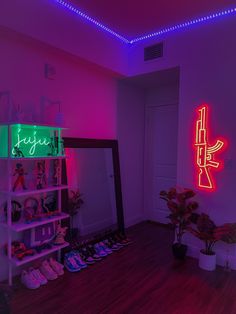 there is a neon sign in the corner of this room with shoes on the floor