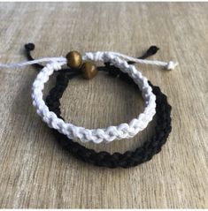 "These lovely bracelets are made with hemp cord. Designed for couples. The smaller bracelet is color white and closes to around 6\"inches. It opens to around 9\" inches. The larger bracelet is color black and closes to around 7\" inches. It opens to around 10\". These bracelets are perfect for couples. Includes Gift Box." White Adjustable Friendship Bracelets, White Sliding Knot Bracelets For Friendship, White Adjustable Braided Bracelets For Friendship, White Resizable Braided Friendship Bracelets, Bracelet Matching, Black And White Couples, Hemp Bracelet, Hemp Jewelry, Hemp Bracelets