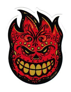 a red and yellow demon face sticker on a white background