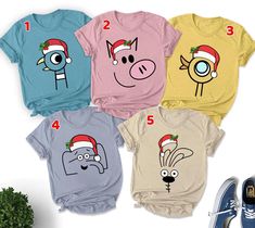 four t - shirts with cartoon characters on them, one is wearing a santa hat and the other has a blue sneaker