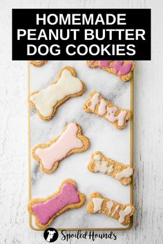 homemade peanut butter dog cookies with pink and white frosting