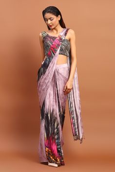 Magenta satin pre-draped saree with all over abstract print and attached pleated draped pallu. Paired with one shoulder neck blouse with all over beads, cut dana and sequin embroidery.
Components: 2
Pattern: Printed and Hand Embroidered
Type Of Work: Abstract Print, Sequin, Bead and Cut Dana Work
Neckline: One Shoulder Neck
Sleeve Type: Sleeveless
Fabric: Satin
Color: Magenta
Other Details: 
Bead tasselled pallu
Printed blouse
Saree Closure: Side concealed zip
Occasion: Sangeet,Cocktail - Aza Fa Printed Blouse Saree, Saree Gowns, Dhoti Saree, Cotton Sarees Handloom, Draped Saree, Saree And Blouse, Pleated Drapes, Ruffle Saree, Drape Saree