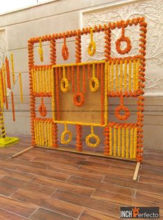 an orange and yellow display with earrings on it