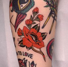 a person with tattoos on their legs and arms, has an image of flowers in the background