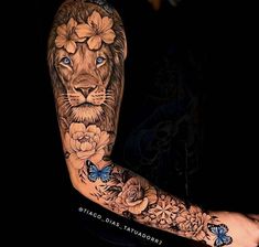 a lion with flowers and butterflies on his arm