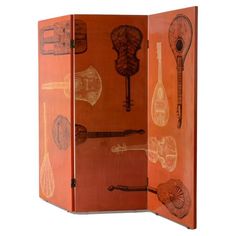 an orange folding screen with musical instruments on the front and side panels, all in different shapes and sizes