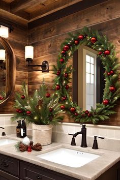 a bathroom decorated for christmas with wreaths and pine cones on the sink counter top