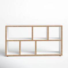 a white shelf with wooden shelves on the top and bottom, against a white background